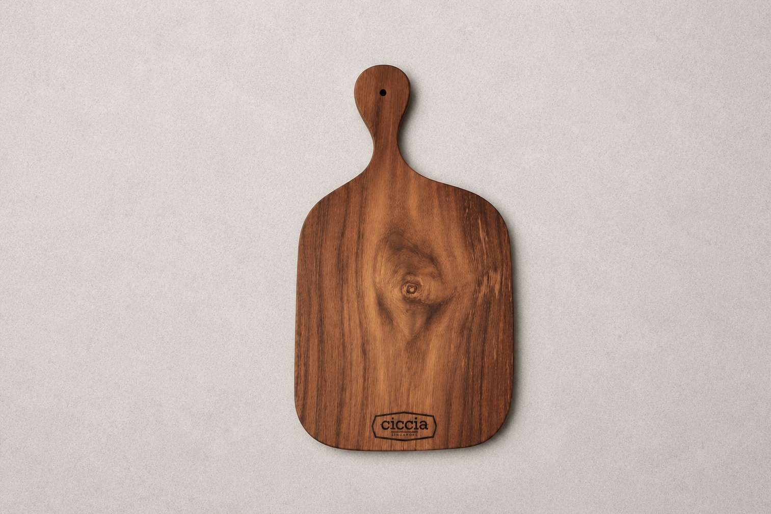 Wooden serving board with rounded handle